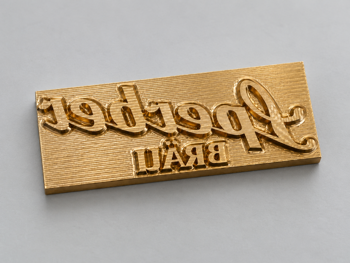 Messingstempel mit individuell erhaben graviertem Schriftzug